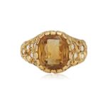 A DIAMOND AND CITRINE INTAGLIO RING The openwork scrolled raised mount, set with brilliant-cut