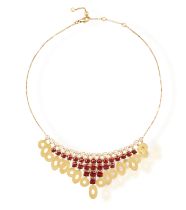 A DIAMOND AND GARNET 'LUCEA' NECKLACE, BY BULGARI, CIRCA 2000 The frontispiece set with a fringe