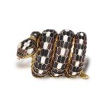 A RARE AND COLLECTIBLE 'SERPENTI' BRACELET WATCH, BY BULGARI, CIRCA 1960 Designed as a snake, the