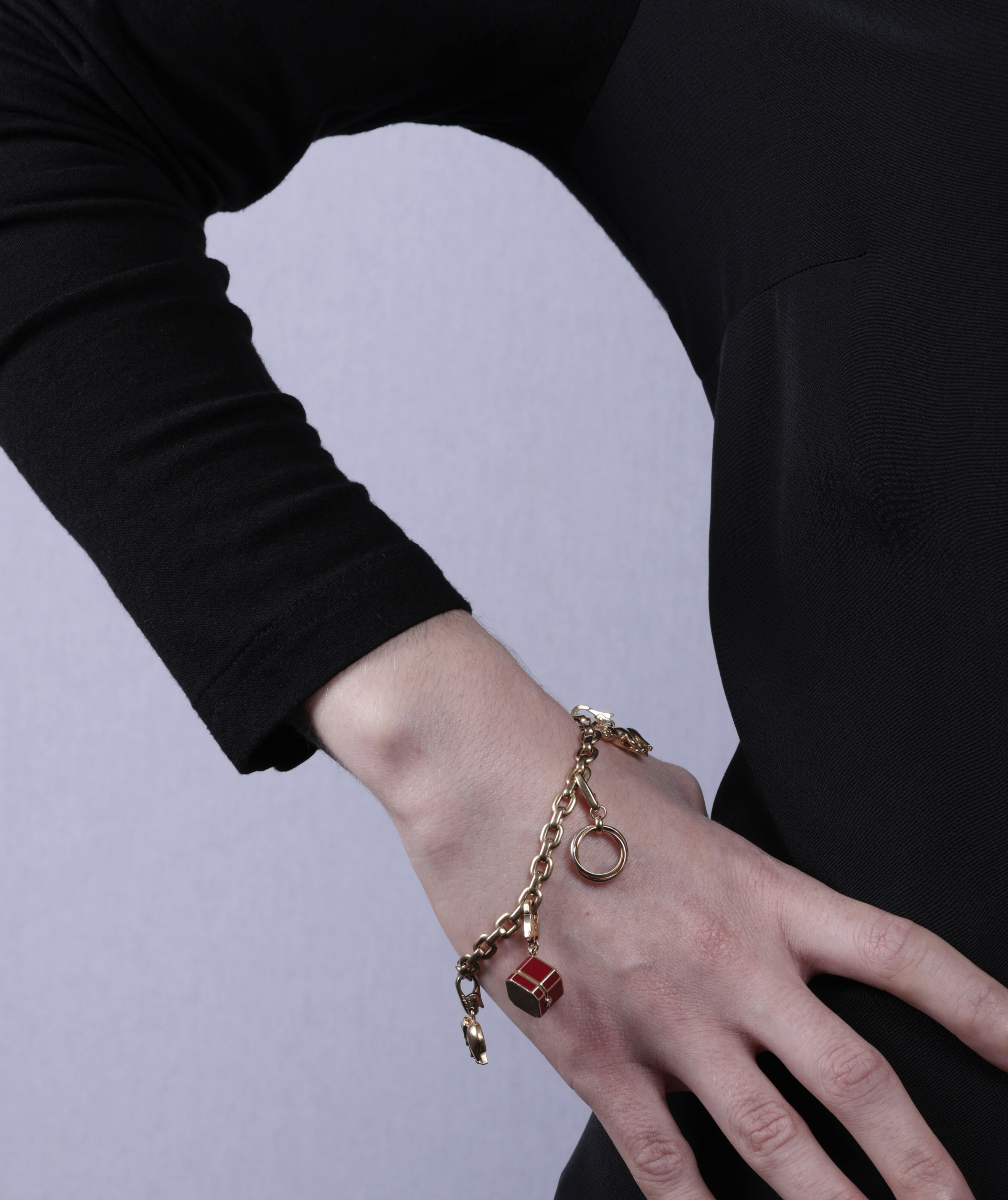 A GOLD CHARM BRACELET, BY CARTIER The belcher-link chain bracelet, suspending five detachable charms - Image 4 of 6