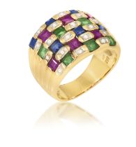 A GEM-SET AND DIAMOND RING The wide band set with square-shaped emeralds, sapphires and rubies and