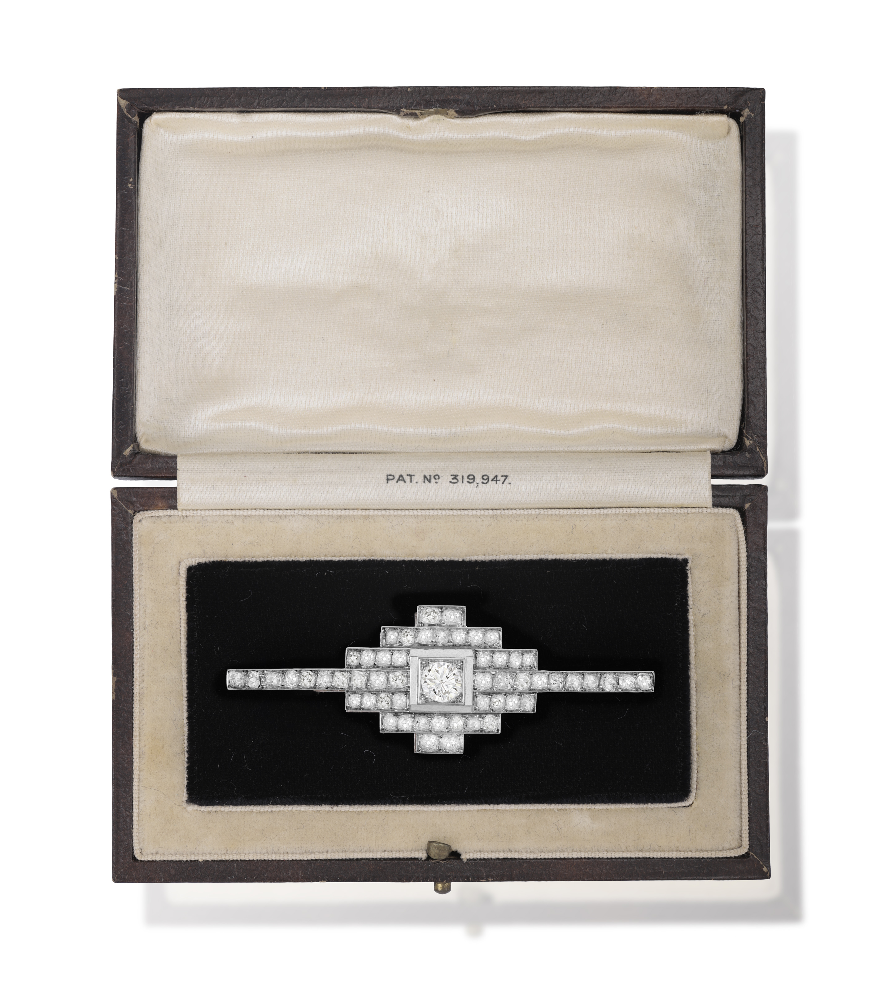 AN ART DECO DIAMOND BROOCH, FRENCH, CIRCA 1925 Of pyramidal design, centring an old European-cut