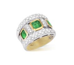 AN EMERALD AND DIAMOND RING Of bi-coloured design, the openwork ring set with three square-shaped