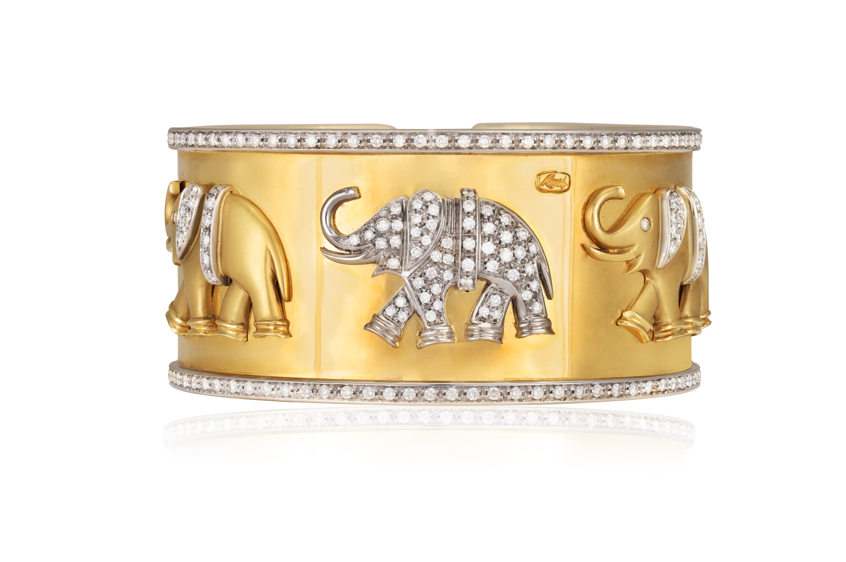 A DIAMOND BANGLE The sprung bangle with three applied elephants at the front, accented and pavé- - Image 2 of 3