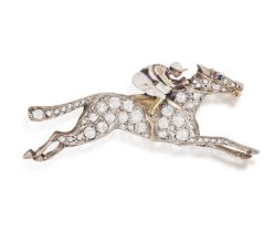 A 19TH CENTURY ENAMEL AND DIAMOND BROOCH, CIRCA 1880 The horse in gallop with enamelled seated