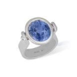 A SAPPHIRE DRESS RING The oval-shaped sapphire weighing approximately 6.50cts, within collet-