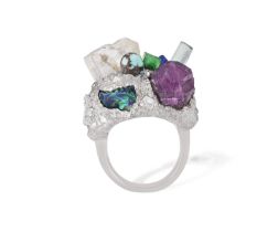 A GEM-SET COCKTAIL RING The mount designed as matrix, set with numerous gemstones such as a topaz, a