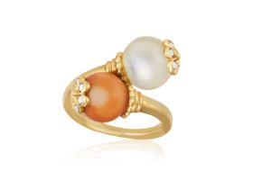 A GEM SET AND DIAMOND DRESS RING, BY CHAUMET, CIRCA 1970 Of crossover design, set with a coral and