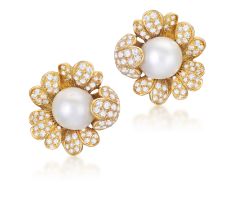 A PAIR OF CULTURED PEARL AND DIAMOND EARCLIPS Each flowerhead centring a cultured pearl of white