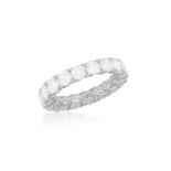 A DIAMOND ETERNITY RING Composed of a continuous row of brilliant-cut diamonds within claw-