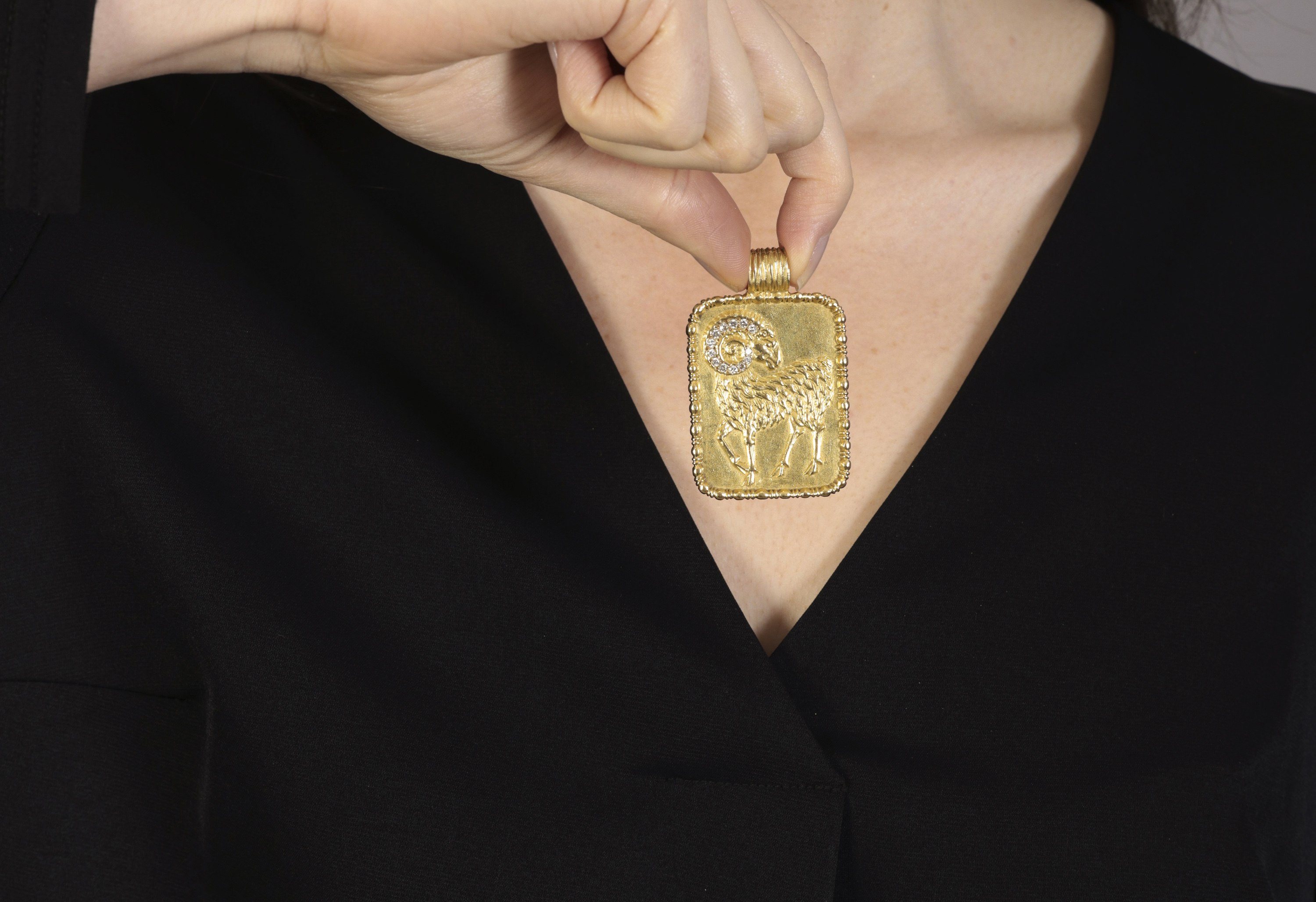 A DIAMOND AND GOLD ZODIAC PENDANT, BY FRED PARIS, CIRCA 1975 The rectangular plaque depicting the - Image 2 of 2
