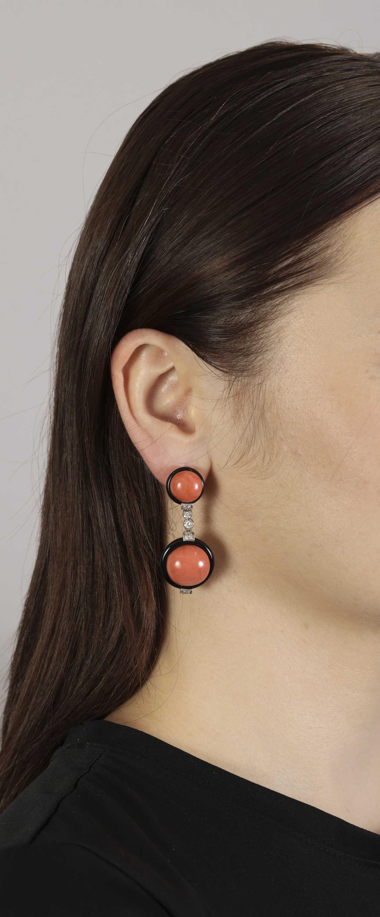 A PAIR OF CORAL, ONYX AND DIAMOND PENDENT EARRINGS Each circular-shaped coral cabochon within an - Image 2 of 2