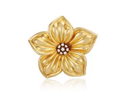 A DIAMOND 'DIANA' BROOCH, BY VAN CLEEF & ARPELS, CIRCA 1990 Designed as a sculpted flowerhead, the