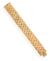A RETRO GOLD BRACELET, BY CARLO WEINGRILL, CIRCA 1955 Composed of fancy polished hinged links, in
