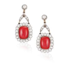 A PAIR OF MID 20TH CENTURY CORAL AND DIAMOND EARRINGS Each set with a cushion-shaped cabochon coral,
