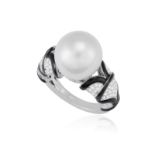 A CULTURED PEARL, ENAMEL AND DIAMOND DRESS RING Centring a cultured pearl of white tint measuring