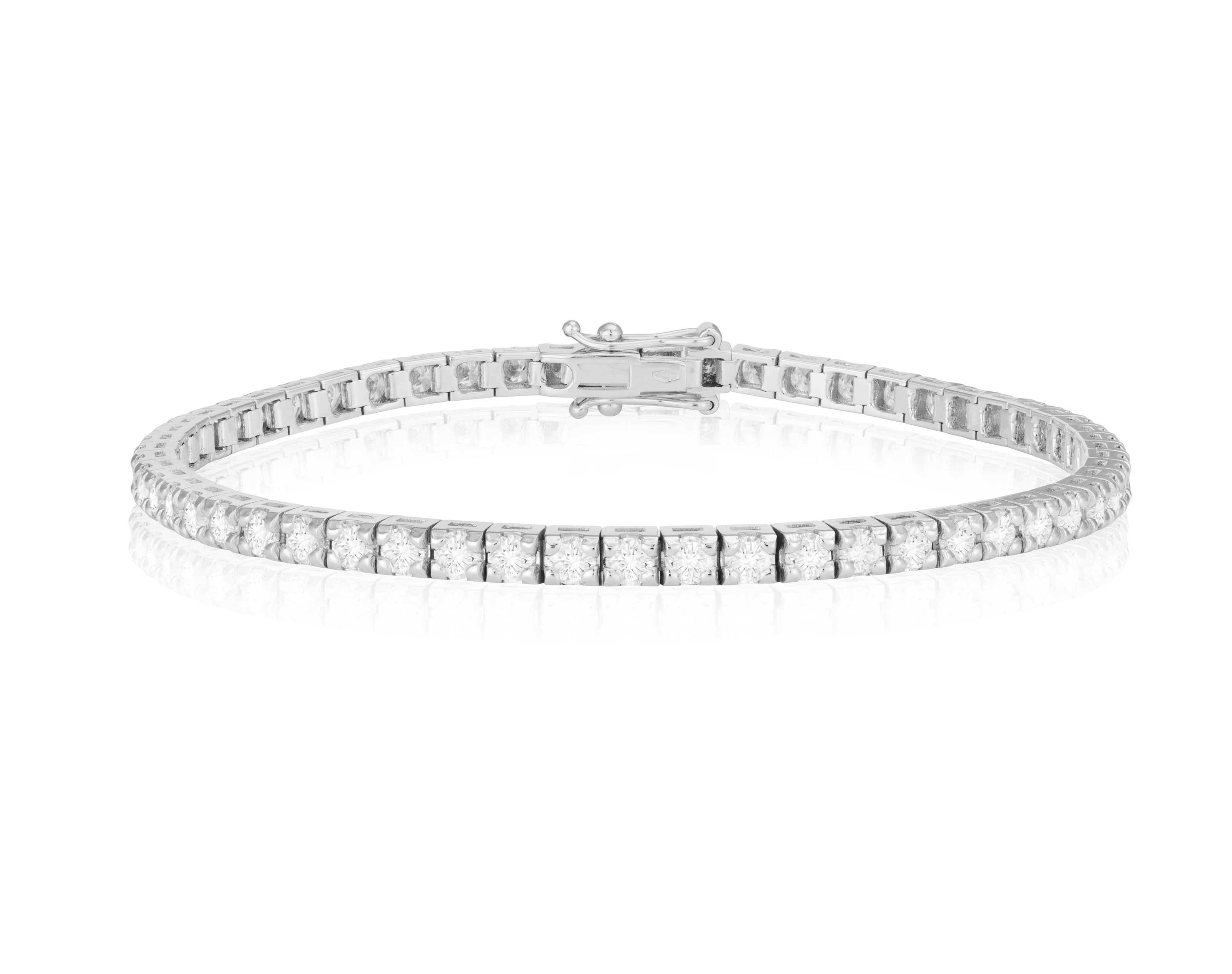 A DIAMOND LINE BRACELET Composed of a continuous line of brilliant-cut diamonds, mounted in 18K - Image 2 of 3