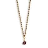 A GOLD NECKLACE WITH GARNET PENDANT, BY POMELLATO The detachable pendant set with a heart-shaped