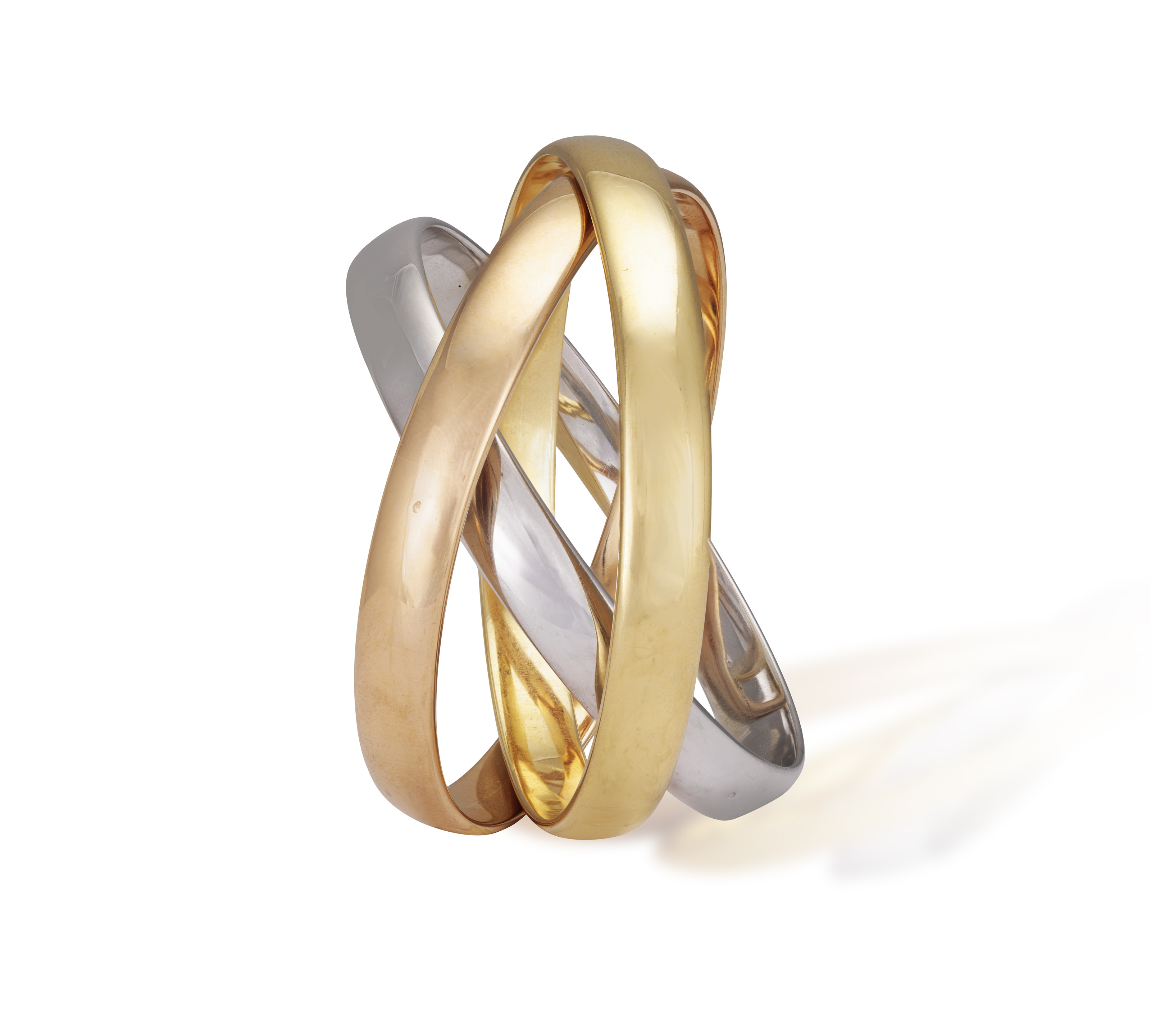 A GOLD 'TRINITY' BANGLE, BY CARTIER Composed of three interlocking polished 18K tri-coloured gold - Image 3 of 6