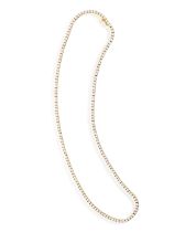 A DIAMOND LINE NECKLACE Composed of a continuous line of brilliant-cut diamonds, mounted in 18K