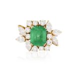 AN EMERALD AND DIAMOND DRESS RING The rectangular cut-cornered emerald weighing approximately 3.