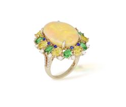 AN OPAL, GEM-SET AND DIAMOND COCKTAIL RING The central oval-shaped opal cabochon weighing