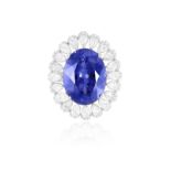 A FINE TANZANITE AND DIAMOND DRESS RING The oval-shaped tanzanite weighing approximately 16.00cts,