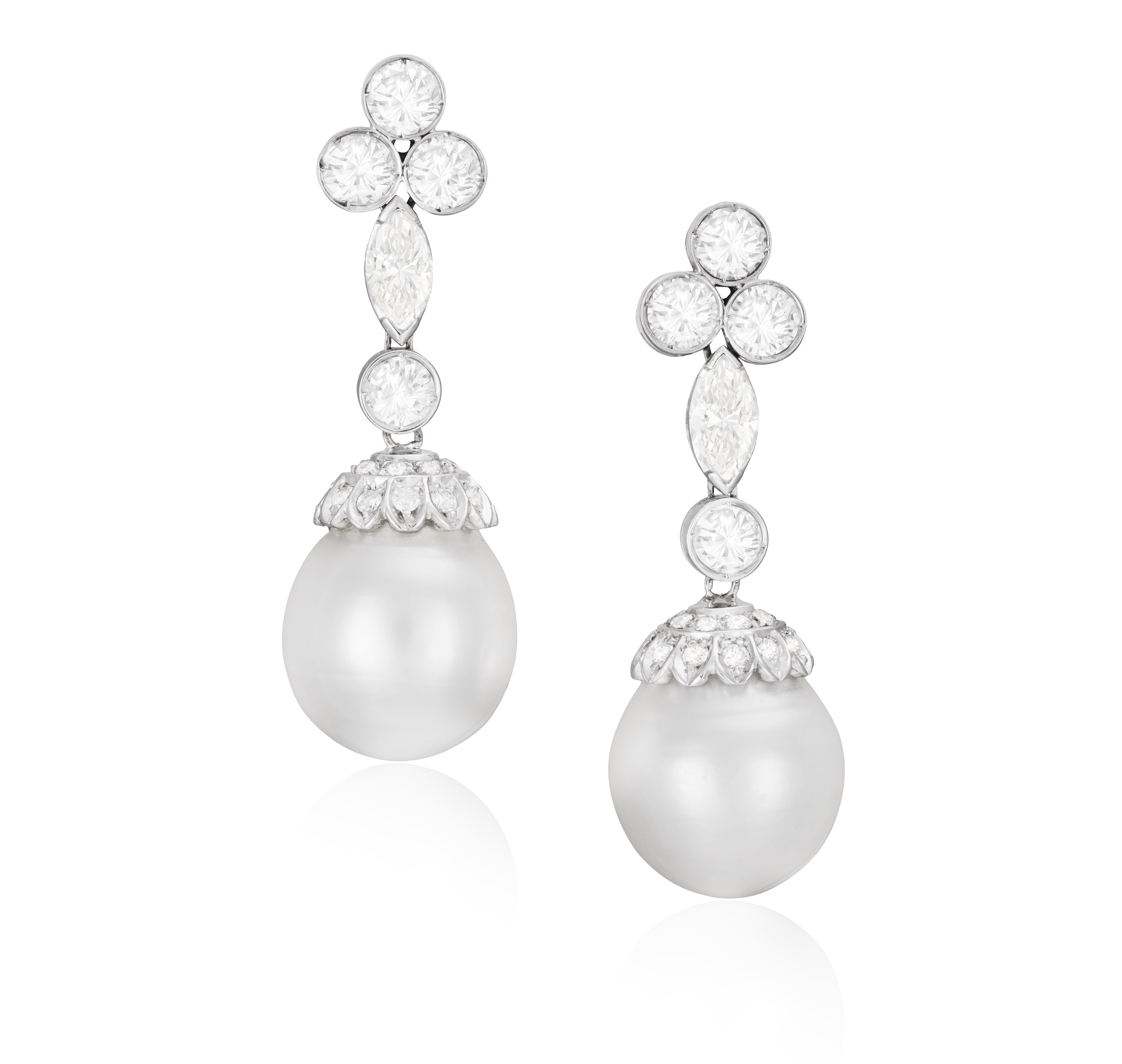 A PAIR OF CULTURED PEARL AND DIAMOND PENDENT EARRINGS Each cultured pearl of white tint measuring