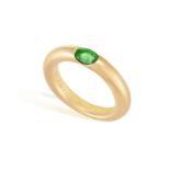 AN EMERALD 'ELLIPSE' RING, BY CARTIER, 1992 The oval-shaped emerald set to a plain hoop, mounted