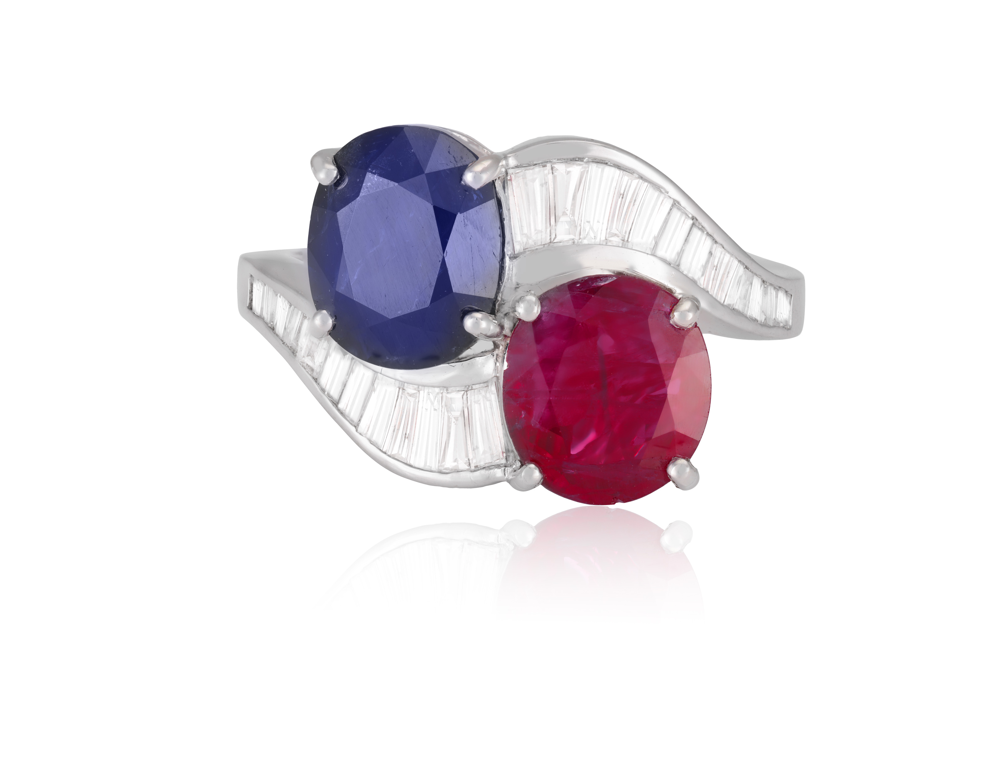 A RUBY, SAPPHIRE AND DIAMOND DRESS RING Of crossover design, set with an oval-shaped sapphire and - Image 2 of 3