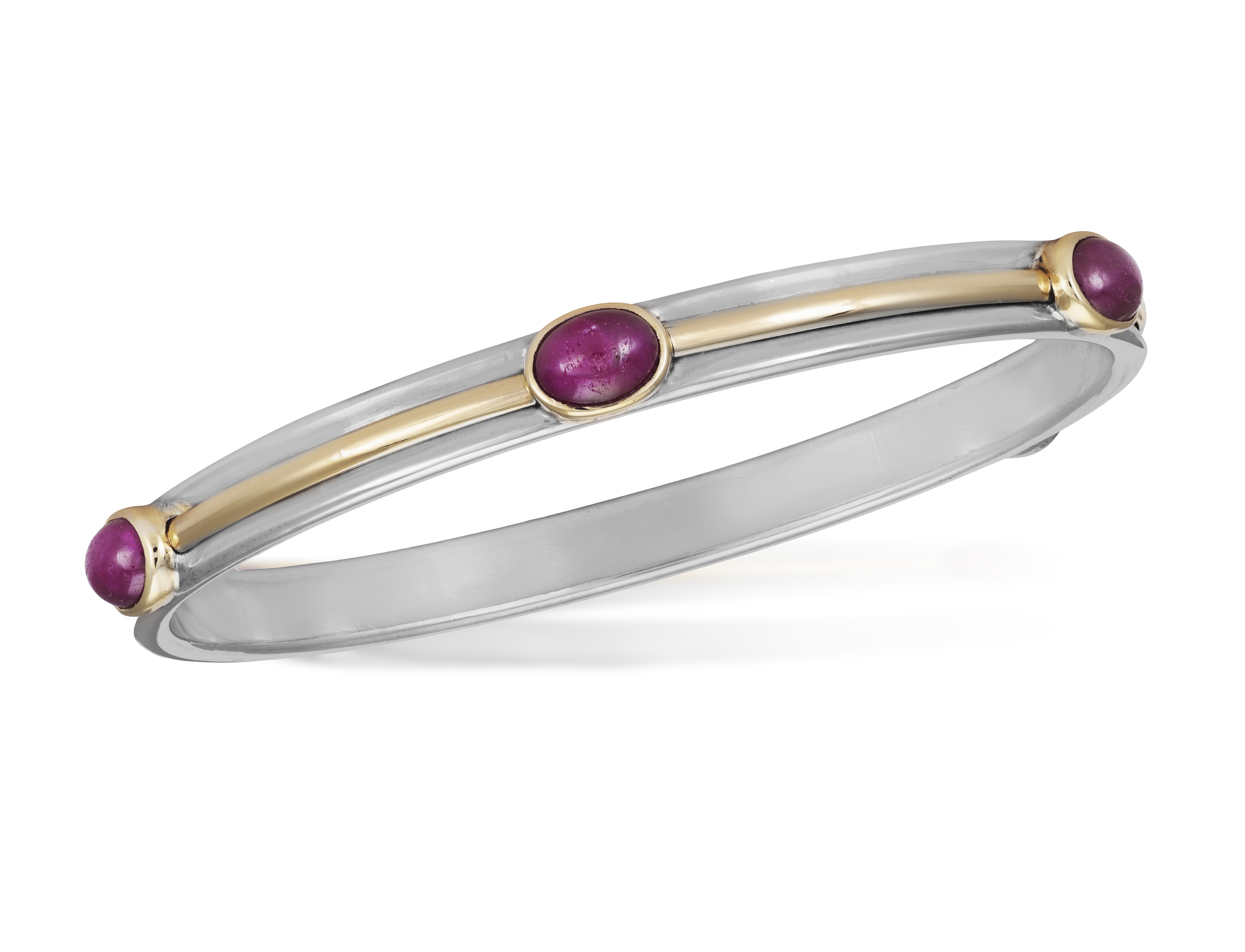 A RUBY BANGLE, BY TIFFANY & CO, CIRCA 1997 Composed of five oval-shaped ruby cabochons within