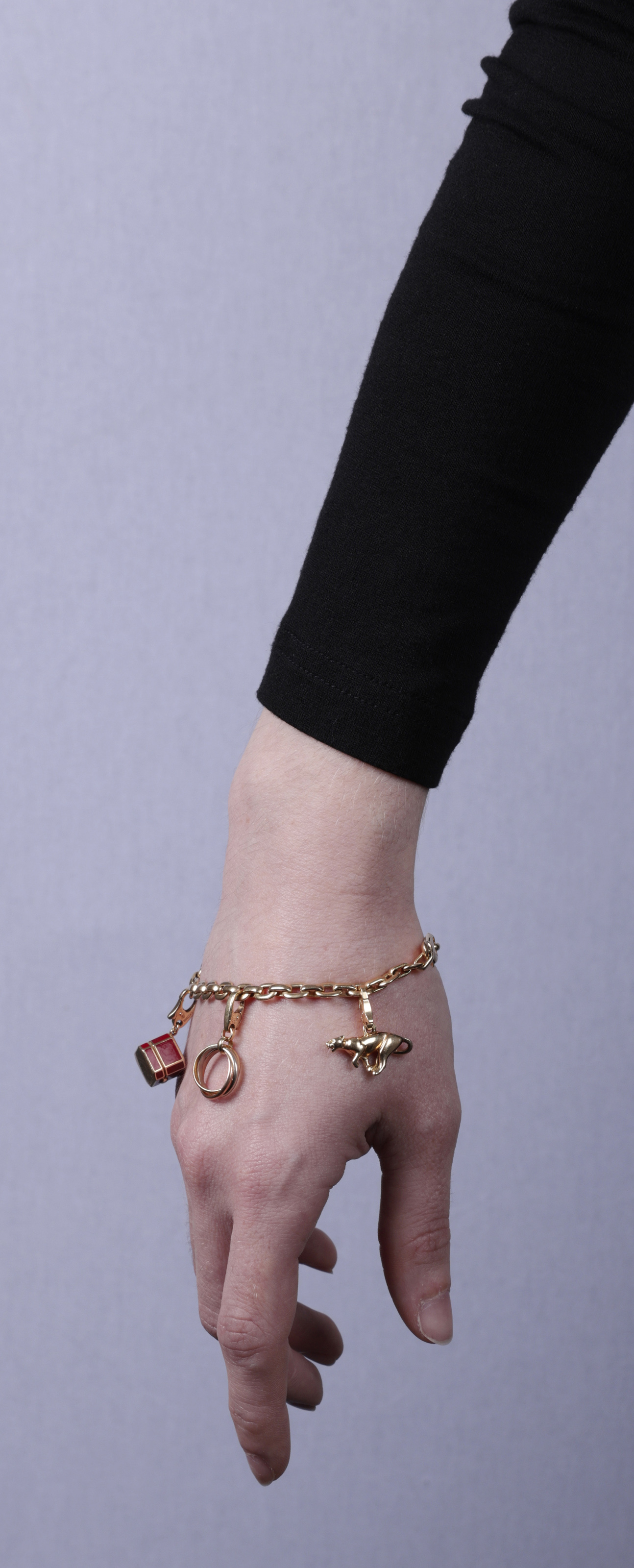 A GOLD CHARM BRACELET, BY CARTIER The belcher-link chain bracelet, suspending five detachable charms - Image 6 of 6
