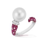 A CULTURED PEARL, RUBY AND DIAMOND DRESS RING The round-shaped cultured pearl of white tint