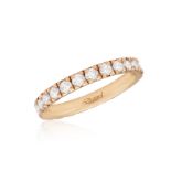 A DIAMOND ETERNITY RING Composed of a continuous line of brilliant-cut diamonds within closed-back