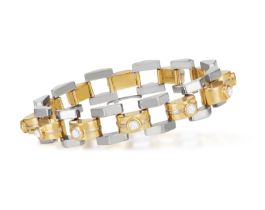 A DIAMOND BRACELET Of tank bi-coloured design, set with a series of brilliant-cut diamonds at the