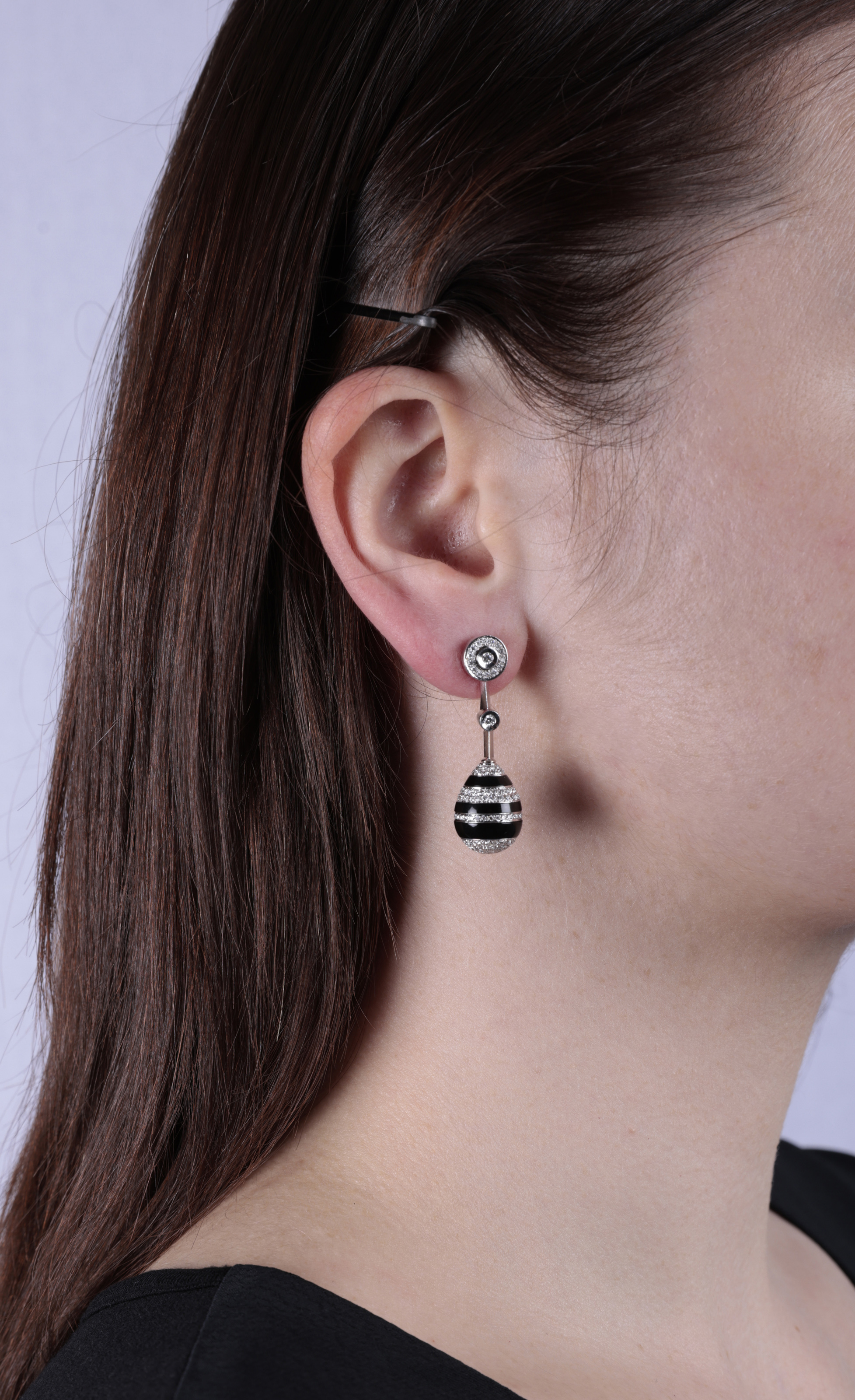 A PAIR OF DIAMOND AND ONYX EARRINGS Of opposing design, each drop-shaped motif set with carved - Image 2 of 2