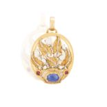 A GEM-SET 'GIARDINETTO' PENDANT Of openwork foliate design, set with an oval-shaped sapphire between