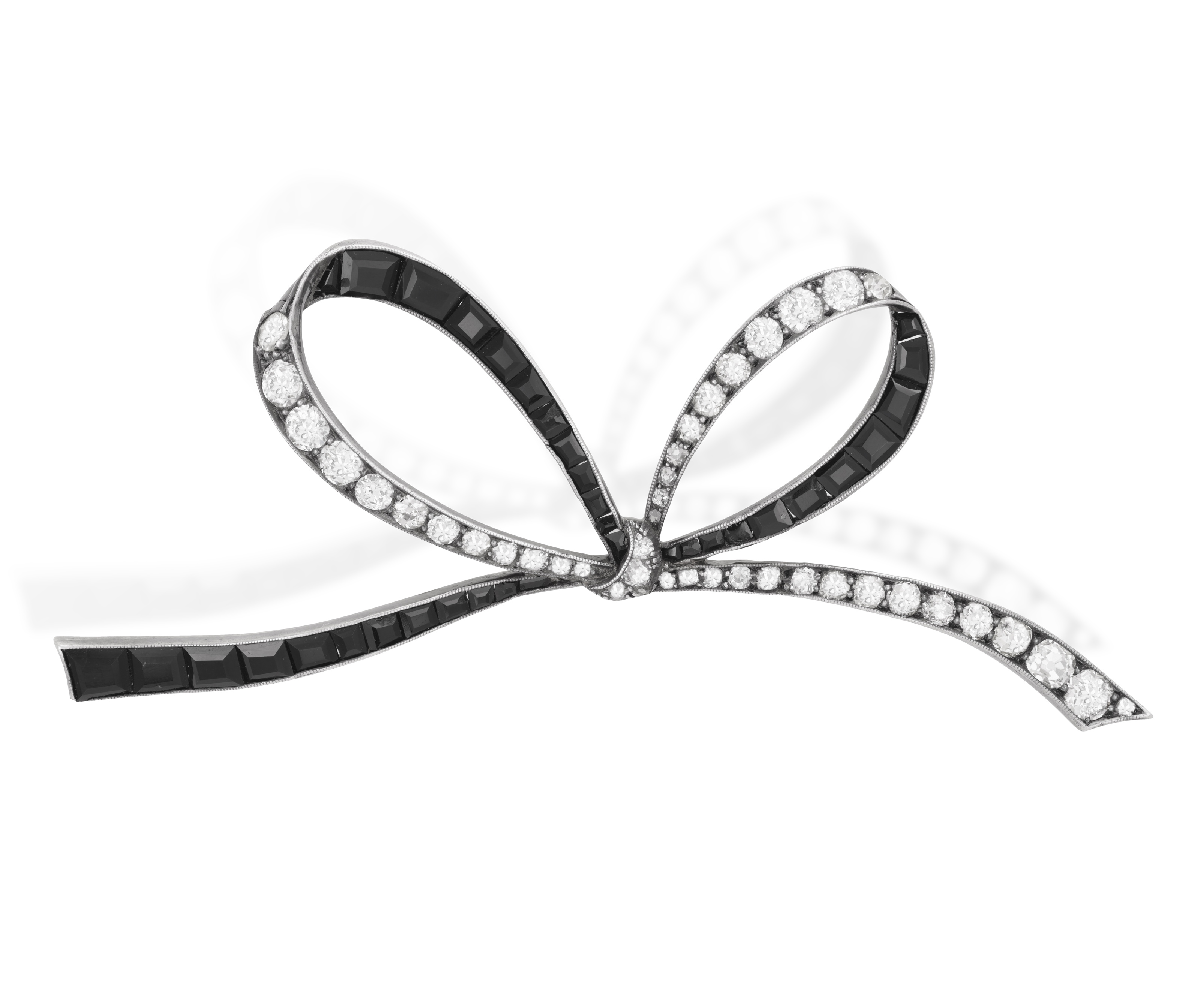 A LATE 19TH CENTURY DIAMOND AND ONYX BOW BROOCH Designed as a ribbon bow, set with old-cut