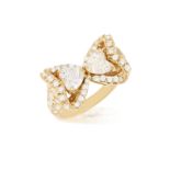 A DIAMOND DRESS RING Designed as an openwork bow, set with two principal heart-shaped diamonds,