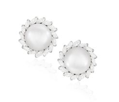 A FINE PAIR OF CULTURED PEARL AND DIAMOND EARCLIPS, BY HARRY WINSTON Each cultured pearl measuring