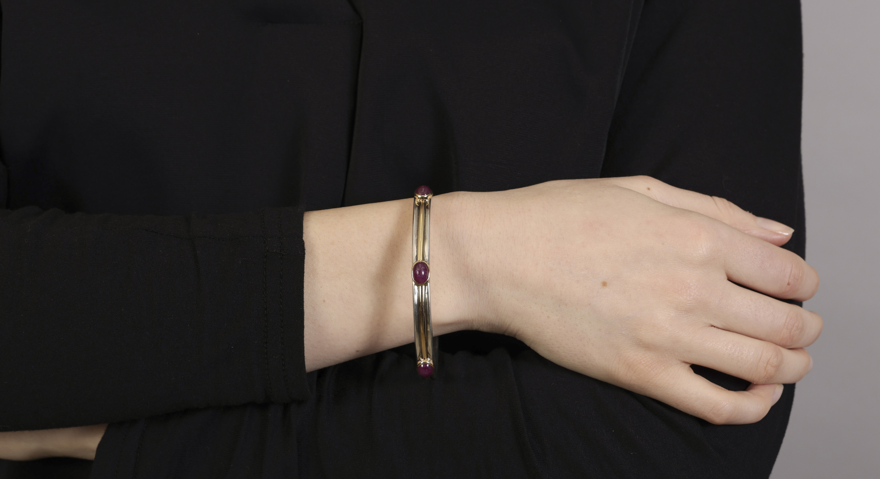 A RUBY BANGLE, BY TIFFANY & CO, CIRCA 1997 Composed of five oval-shaped ruby cabochons within - Image 2 of 3