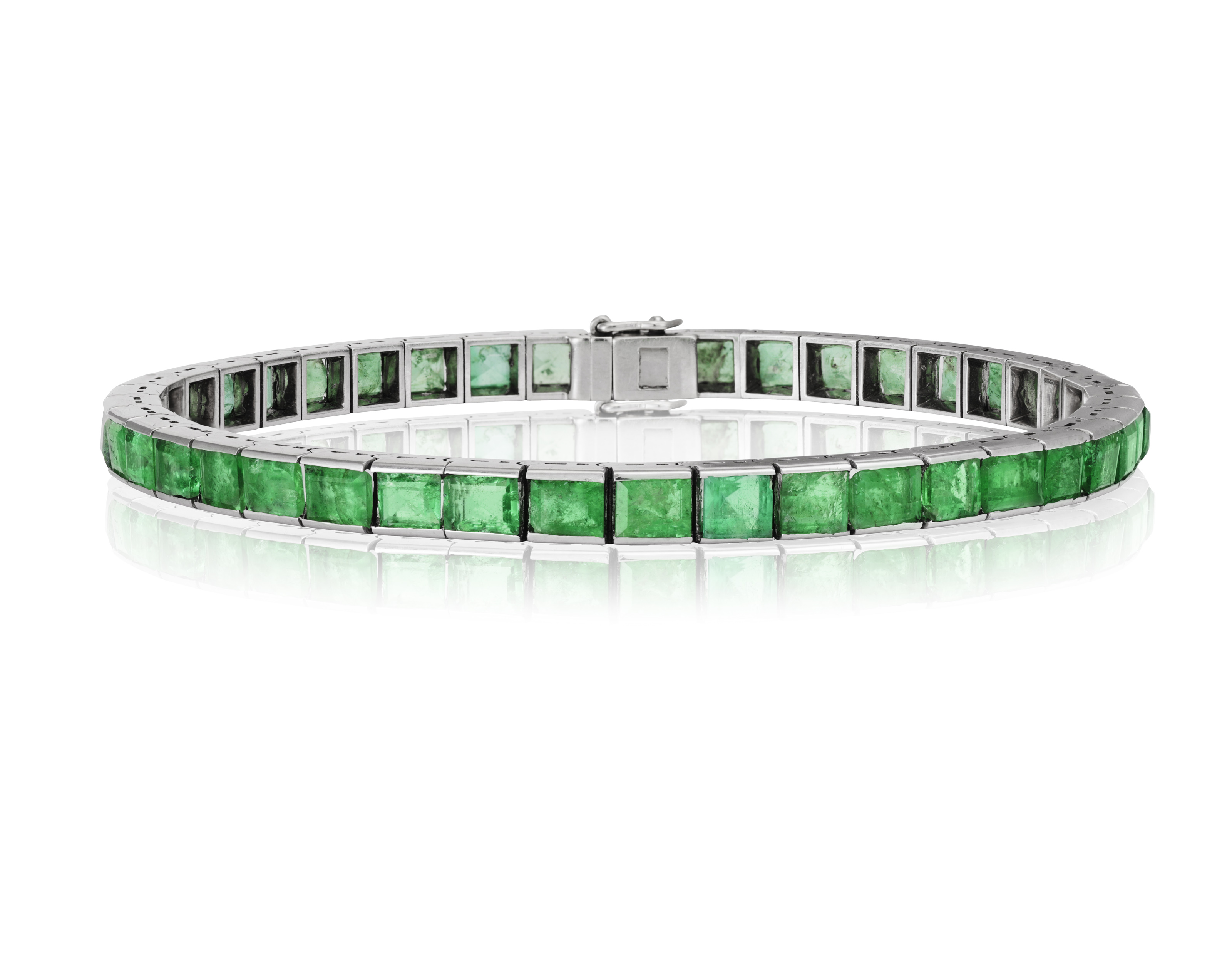 AN EMERALD LINE BRACELET Composed of a continuous line of rectangular-cut emeralds, mounted in 18K - Image 2 of 3