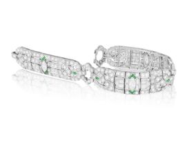 A DIAMOND BRACELET Composed of openwork motifs of geometric and foliate design, the central one