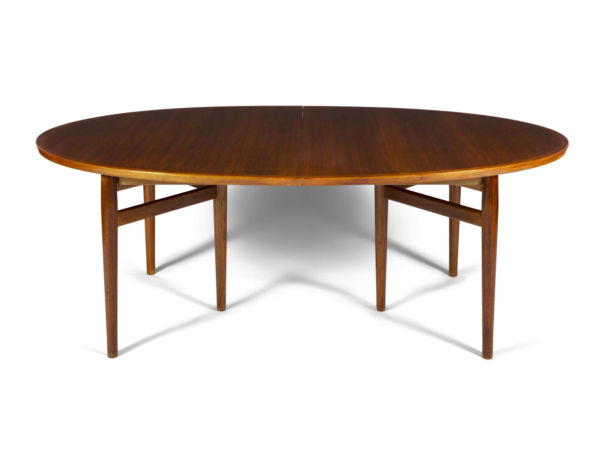 ARNE VODDER (1926-2009) A teak oval extending dining table with two leaves by Arne Vodder.