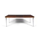 W.K. MOBEL A rosewood extending dining table by W.K. Mobel with hidden leaf with maker's label.