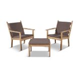 HANS WEGNER (1914 - 2007) A pair of Hans Wegner armchairs and foot-stool for Getama,