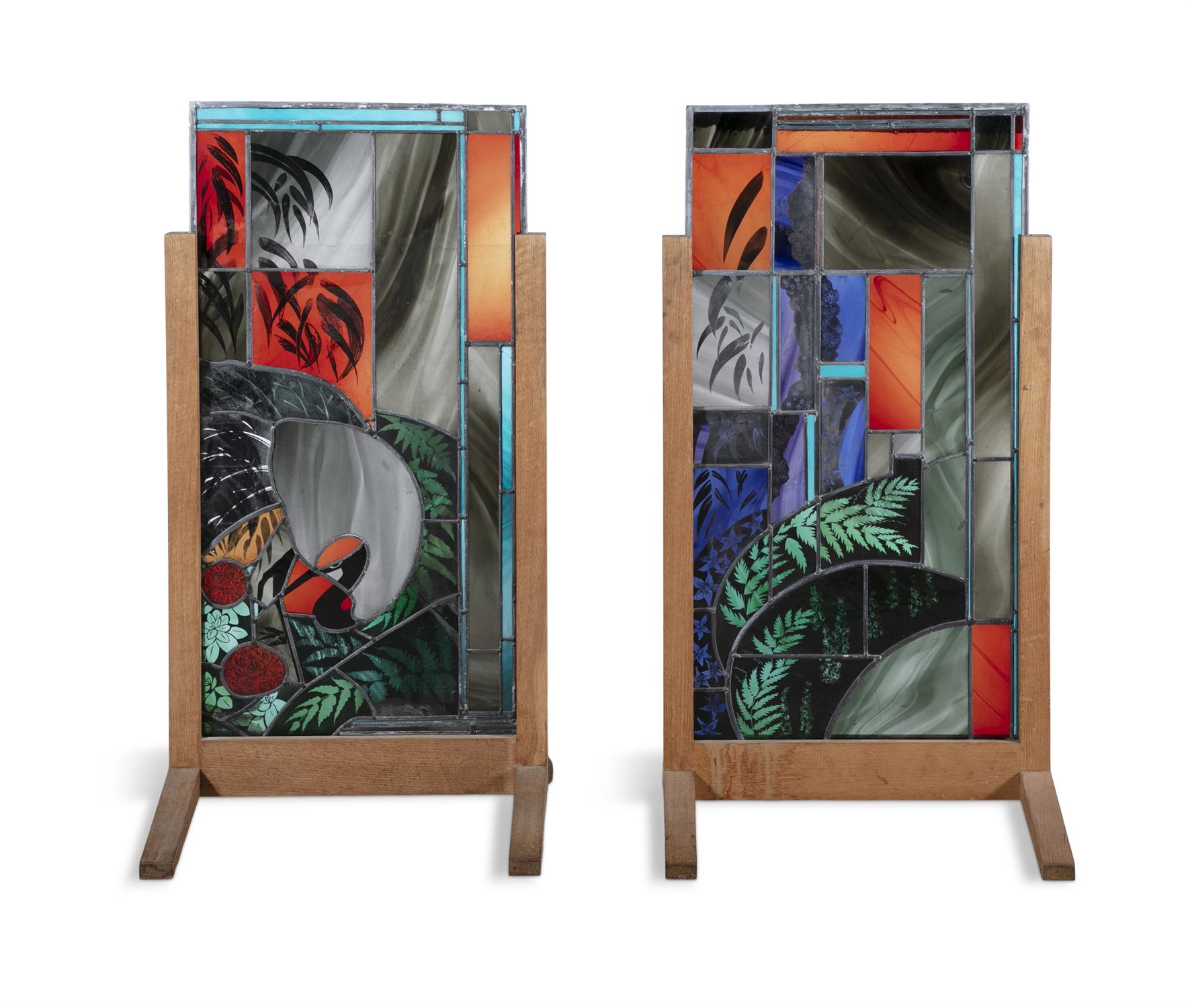GLASS PANELS A pair of stained glass panels on oak stands. 66 x 48 x 130cm(h) including stands