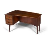 DESK A teak boomerang desk with three drawers and one drop down door with maker's label. Sweden,