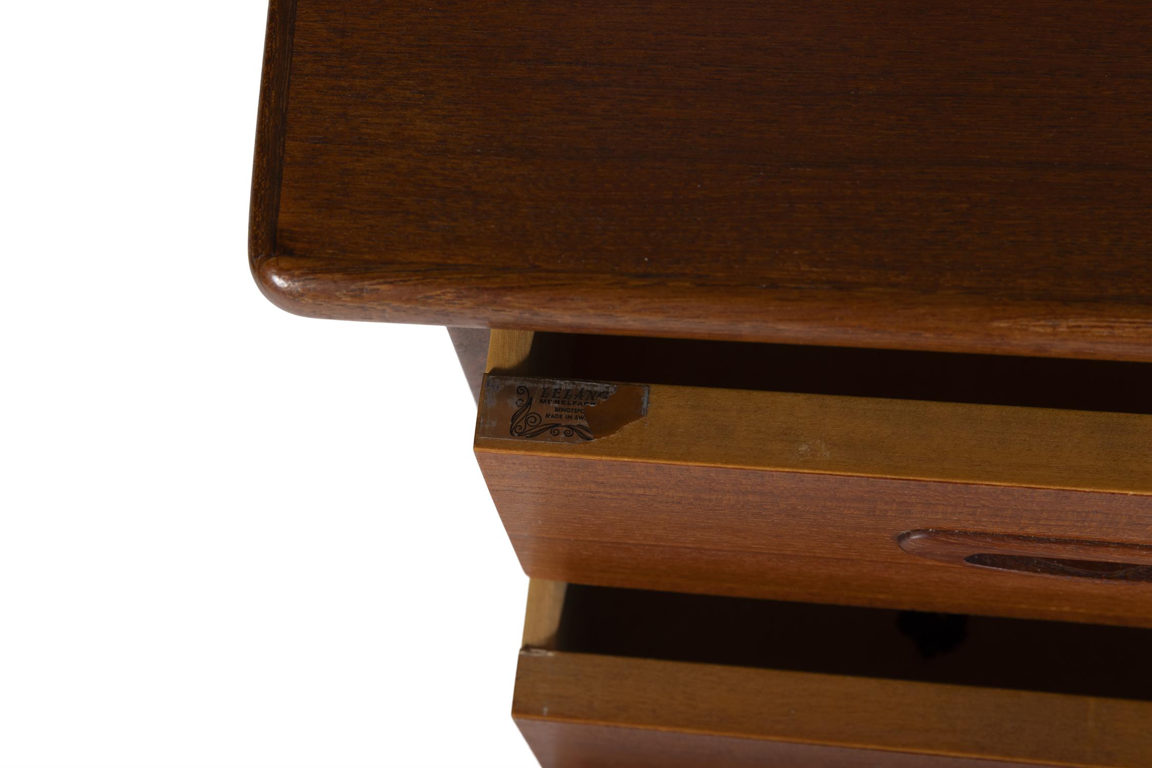 DESK A teak boomerang desk with three drawers and one drop down door with maker's label. Sweden, - Image 10 of 10