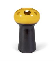 VASE A yellow and black ceramic vase.